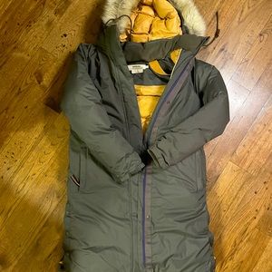 Long down puffer.  Army green outer, golden yellow inside, w/backpack straps